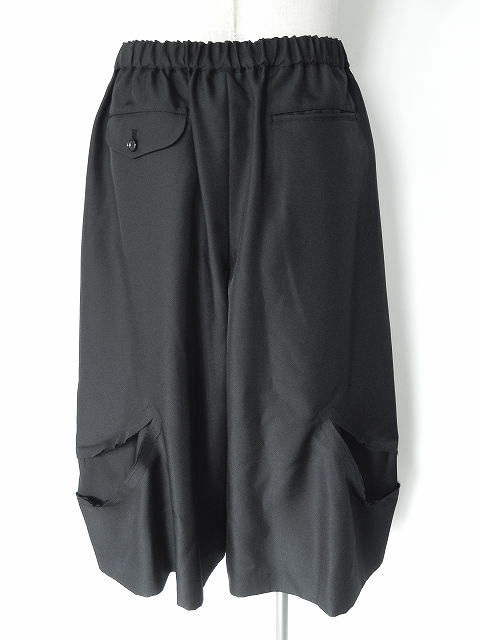 Comme des Garçons black top stretched out on one side — AD